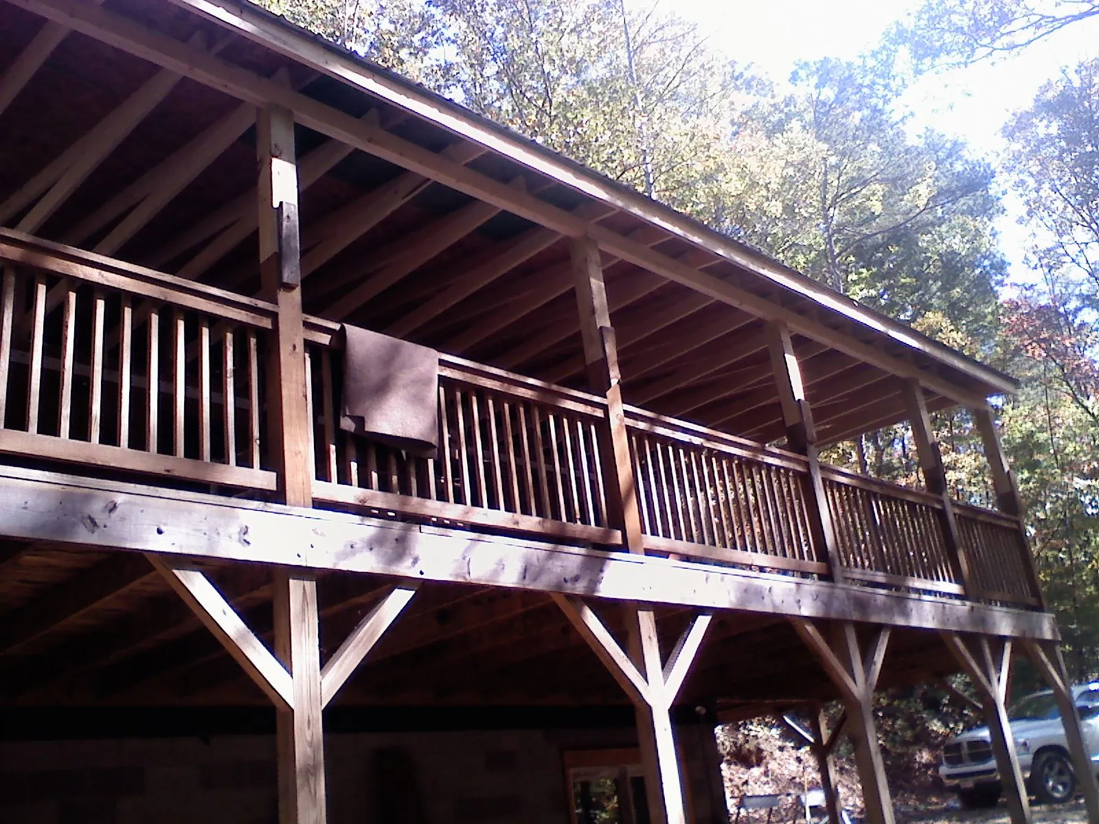 Timber framing under a new elevated porch and deck — Roof Leak Repair in Northport by Roofing Brothers